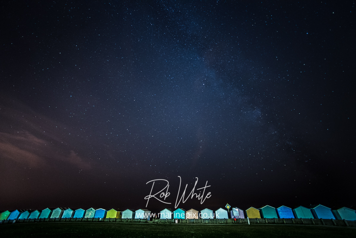 beach huts at night